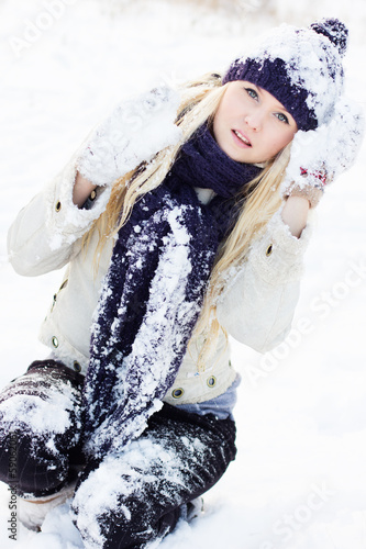 Photo: beautiful winter woman playing with snow beautiful winter woman playing with snow