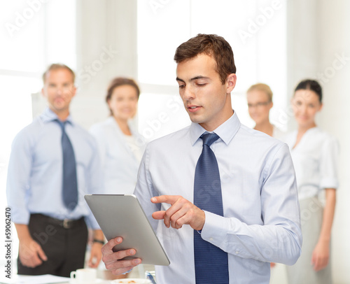 Photo: buisnessman with tablet pc buisnessman with tablet pc