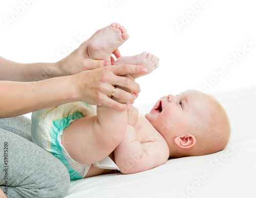 Photo: mother doing gymnastics her baby boy infant mother doing gymnastics her baby boy infant