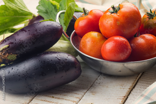 Photo: Fresh vegetables on wooden table Fresh vegetables on wooden table