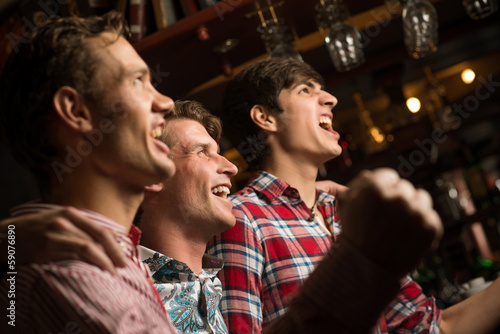 Photo: portrait of the fans in the bar portrait of the fans in the bar