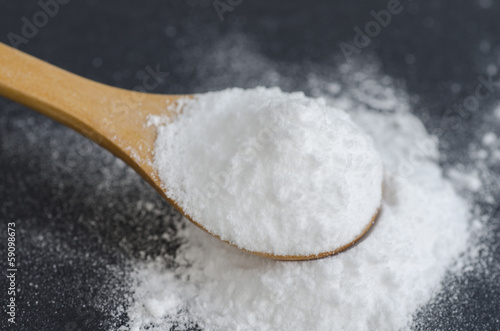 Photo: Sodium bicarbonate in a wooden spoon Sodium bicarbonate in a wooden spoon