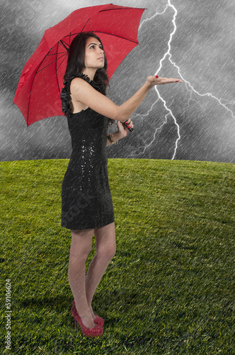 Photo: Woman Holding Umbrella Woman Holding Umbrella