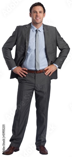 Photo: Smiling businessman with hands on hips Smiling businessman with hands on hips