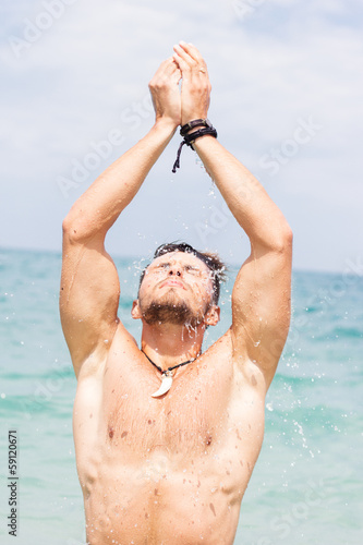 Photo: Portrait of cute young man on the beach Portrait of cute young man on the beach