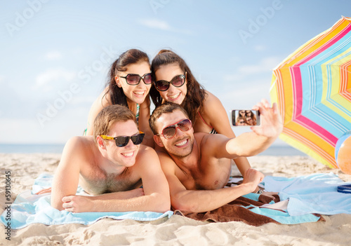 Photo: group of people taking picture with smartphone group of people taking picture with smartphone