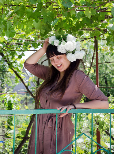 Photo: Smiling woman out collecting spring blossom Smiling woman out collecting spring blossom