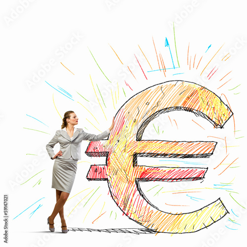 Photo: Businesswoman leaning on euro sign Businesswoman leaning on euro sign