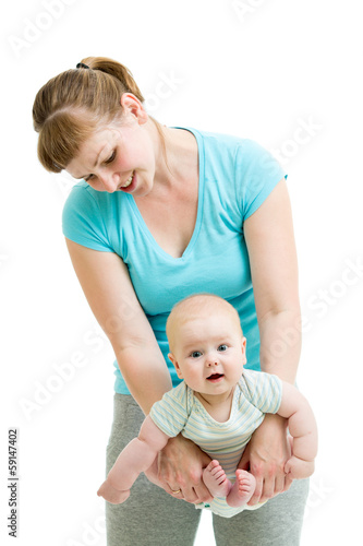 Photo: mother doing yoga for baby isolated mother doing yoga for baby isolated