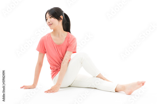 Photo: young asian woman exercising on white background young asian woman exercising on white background