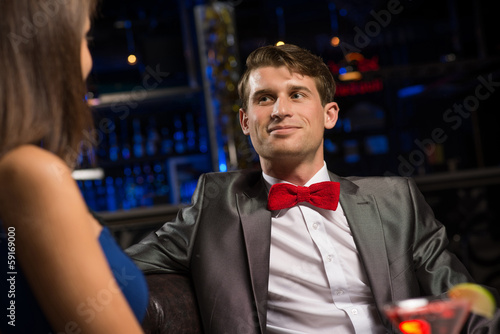 Photo: portrait of a man in a nightclub portrait of a man in a nightclub