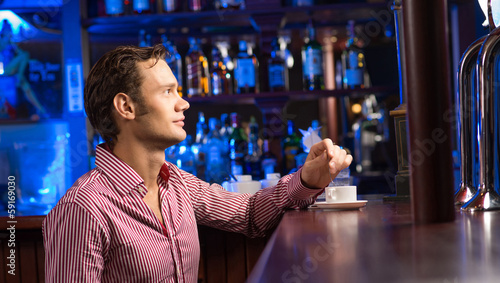 Photo: man with a cup of coffee man with a cup of coffee