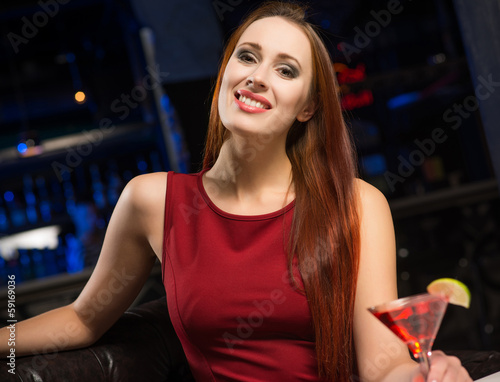 Photo: Portrait of an attractive woman in a nightclub Portrait of an attractive woman in a nightclub