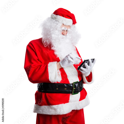 Photo: Weihnachtsmann mit Tablet Weihnachtsmann mit Tablet