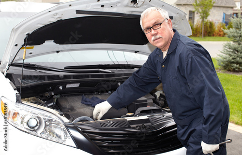 Photo: Car mechanic. Car mechanic.