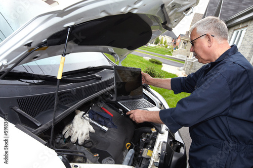 Photo: Car mechanic. Car mechanic.
