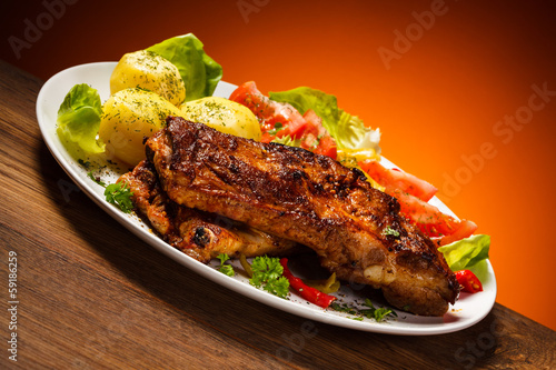 Photo: Tasty grilled ribs with vegetables Tasty grilled ribs with vegetables