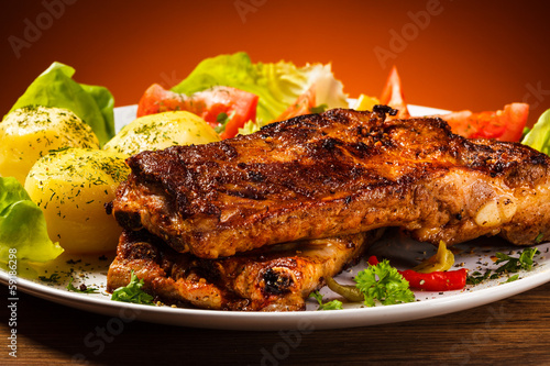Photo: Tasty grilled ribs with vegetables Tasty grilled ribs with vegetables