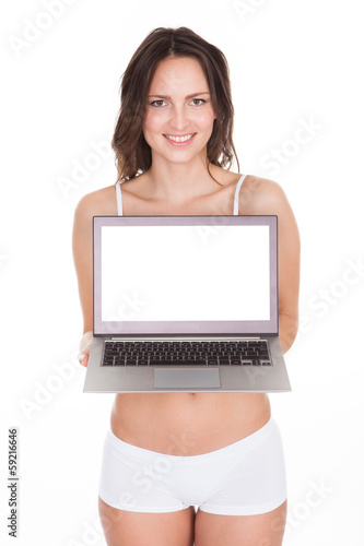 Photo: Young Woman Showing Laptop Young Woman Showing Laptop