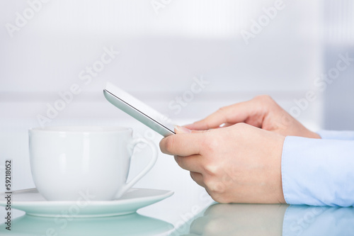 Photo: Businesswoman Holding Digital Tablet Businesswoman Holding Digital Tablet