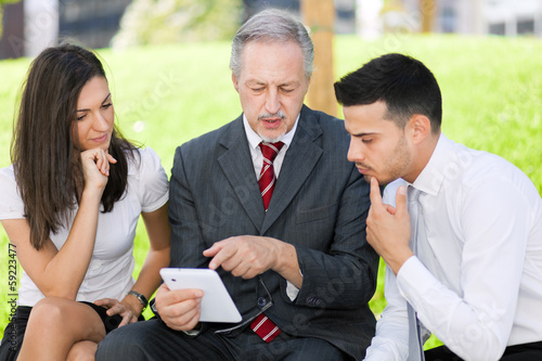 Photo: Businesspeople using a tablet Businesspeople using a tablet