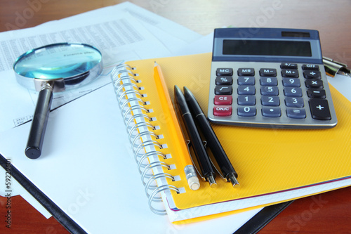 Photo: Office supplies and documents close up Office supplies and documents close up
