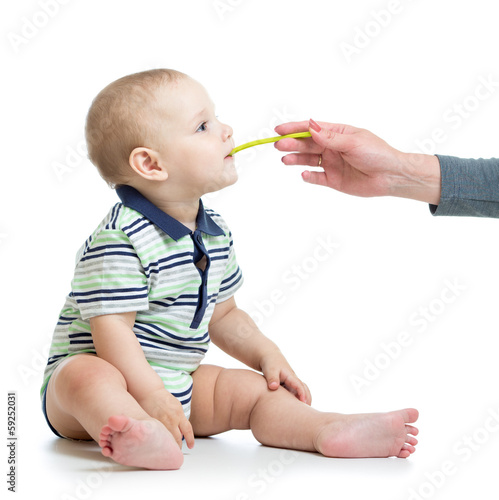 Photo: baby feeding with a spoon baby feeding with a spoon