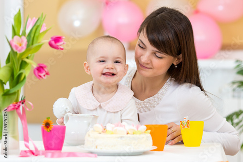 Photo: baby and mother celebrate first birthday baby and mother celebrate first birthday