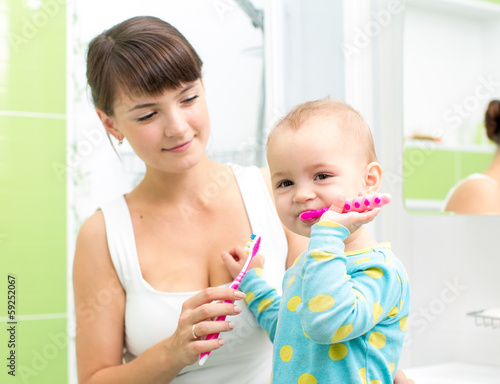 Photo: baby brushing teeth in bathroom baby brushing teeth in bathroom