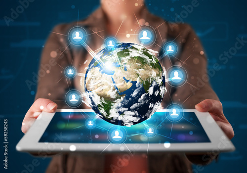 Photo: Woman presenting 3d earth globe in modern tablet Woman presenting 3d earth globe in modern tablet