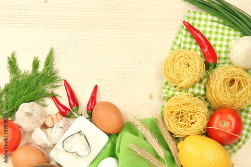 Photo: Cooking concept. Groceries on wooden table Cooking concept. Groceries on wooden table