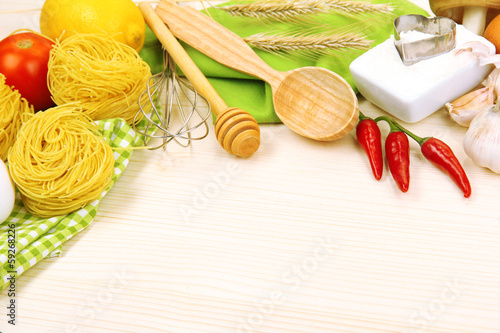 Photo: Cooking concept. Groceries on wooden table Cooking concept. Groceries on wooden table