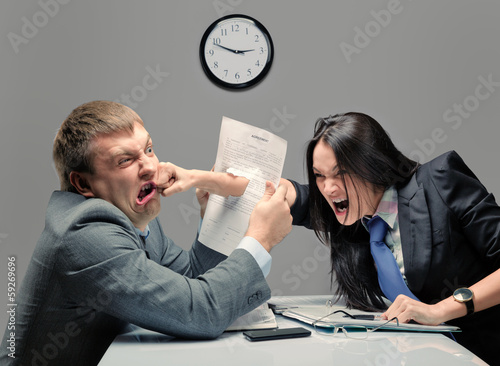 Photo: Two young caucasian office worker starting to fight Two young caucasian office worker starting to fight