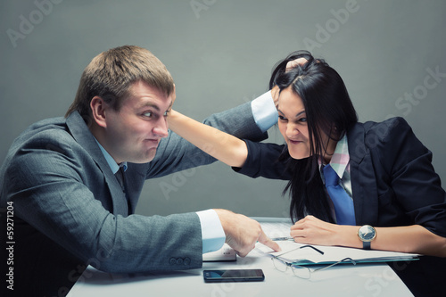 Photo: Two young caucasian office worker starting to fight Two young caucasian office worker starting to fight