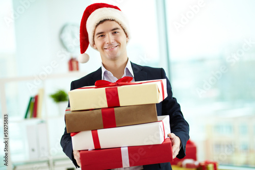 Photo: Businessman with presents Businessman with presents