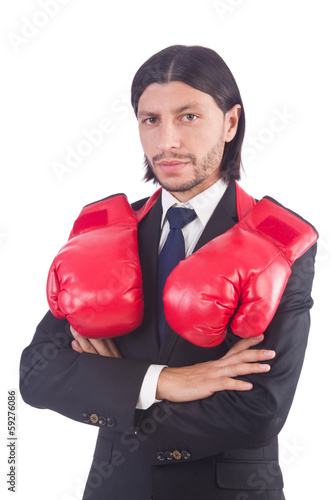 Photo: Businessman with boxing gloves on white Businessman with boxing gloves on white