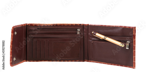 Photo: Opened brown leather purse. Opened brown leather purse.