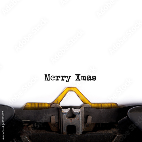 Photo: "MERRY XMAS" message typed by vintage typewriter. "MERRY XMAS" message typed by vintage typewriter.