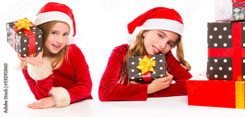 Photo: Christmas Santa kid sister girls happy excited with ribbon gifts Christmas Santa kid sister girls happy excited with ribbon gifts