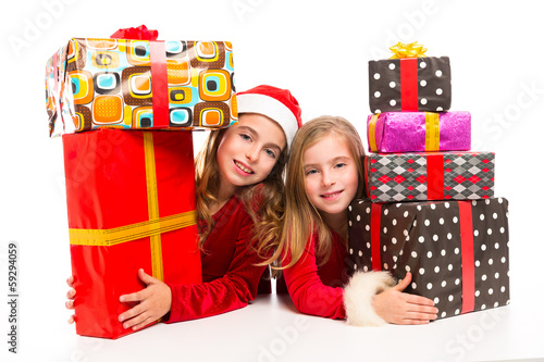 Photo: Christmas Santa kid girls with many gifts stacked Christmas Santa kid girls with many gifts stacked