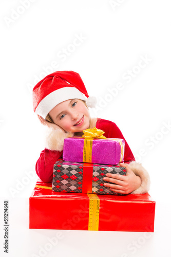 Photo: Christmas Santa kid girl happy excited with ribbon gifts Christmas Santa kid girl happy excited with ribbon gifts