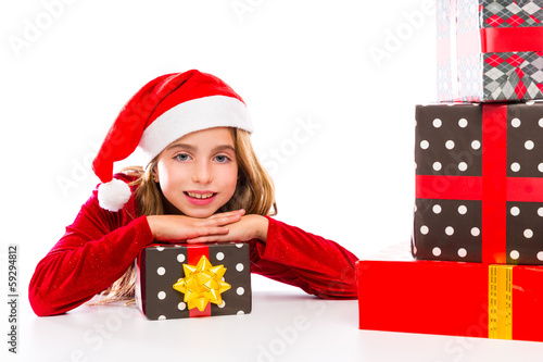 Photo: Christmas Santa kid girl happy excited with ribbon gifts Christmas Santa kid girl happy excited with ribbon gifts