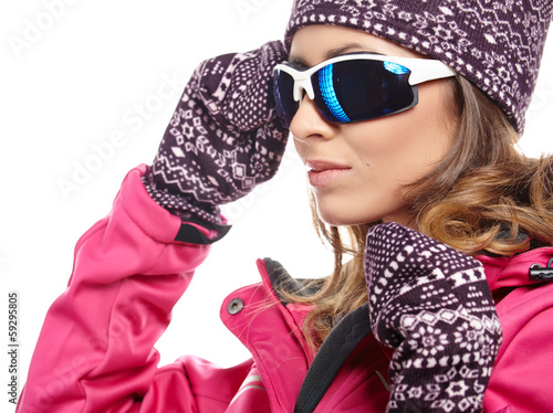 Photo: Young beautiful woman in winter clothes isolated on white Young beautiful woman in winter clothes isolated on white