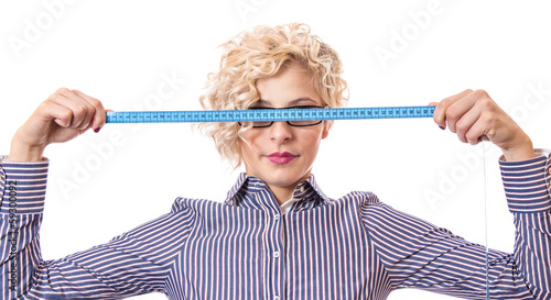 Photo: Young businesswoman with measurnig tape, isolated Young businesswoman with measurnig tape, isolated