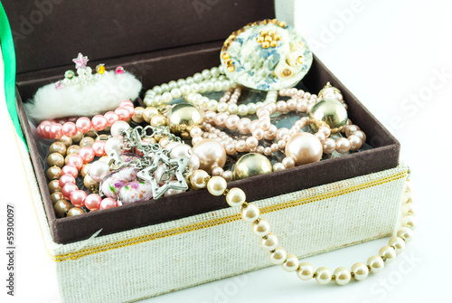 Photo: jewelry box with jewelry - Treasure of pearls on white jewelry box with jewelry - Treasure of pearls on white
