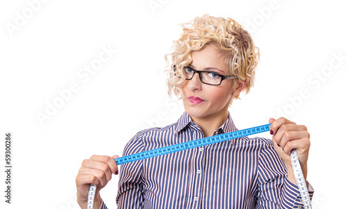 Photo: Young businesswoman with measurnig tape, isolated Young businesswoman with measurnig tape, isolated