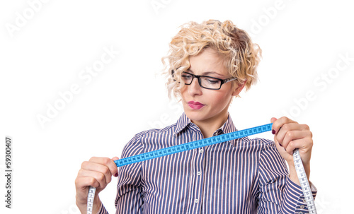 Photo: Young businesswoman with measurnig tape, isolated Young businesswoman with measurnig tape, isolated