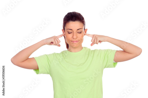 Photo: Smiling woman covering her ears Smiling woman covering her ears