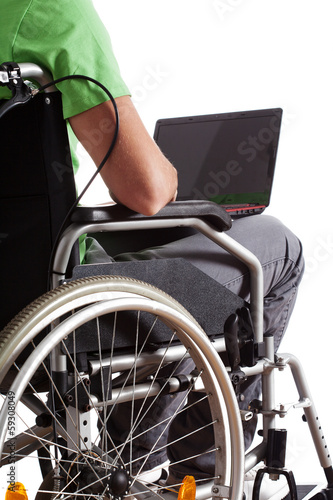 Photo: Student with laptop on wheelchair Student with laptop on wheelchair