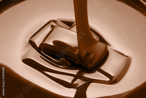 Photo: melted dark chocolate being poured melted dark chocolate being poured